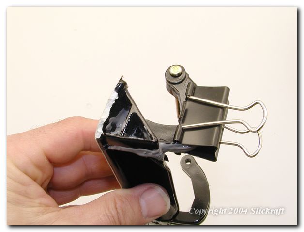 A binder type clip works best to apply pressure to squeeze the assembly together.